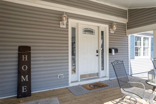 doorway to property featuring a porch