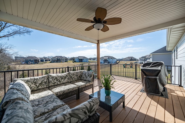 deck featuring a residential view, an outdoor hangout area, ceiling fan, and area for grilling