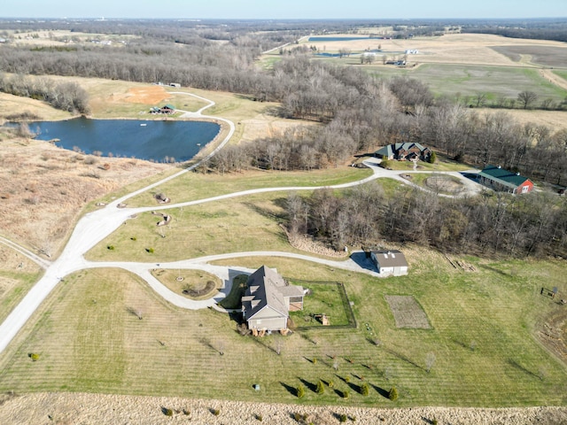 birds eye view of property with a rural view and a water view