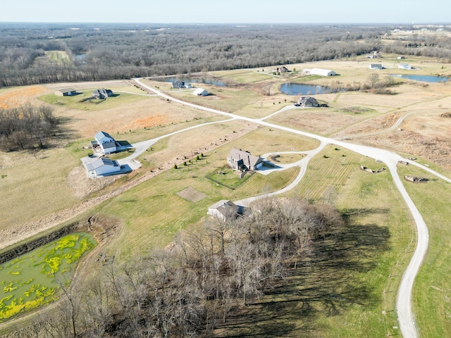 birds eye view of property with a rural view