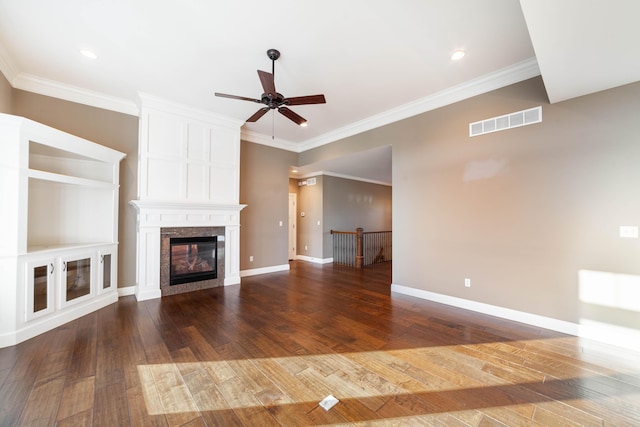 unfurnished living room featuring dark wood-style floors, baseboards, visible vents, ceiling fan, and crown molding