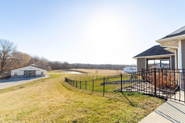 view of yard with an outdoor structure and fence