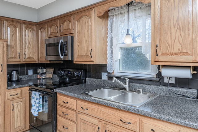 kitchen featuring decorative backsplash, stainless steel microwave, black electric range, and a sink