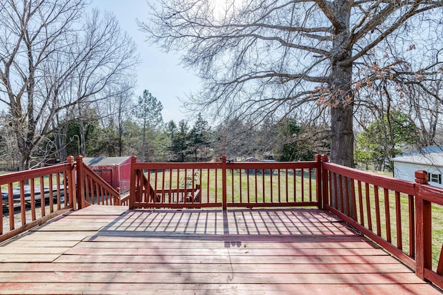 wooden deck with a lawn