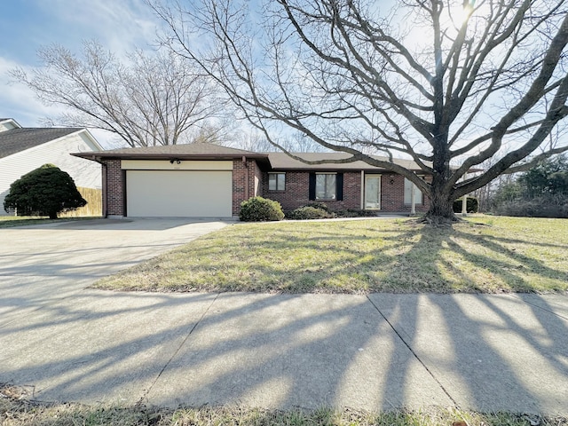 single story home featuring concrete driveway, brick siding, a garage, and a front lawn