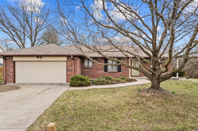 ranch-style home featuring roof with shingles, an attached garage, concrete driveway, a front lawn, and brick siding