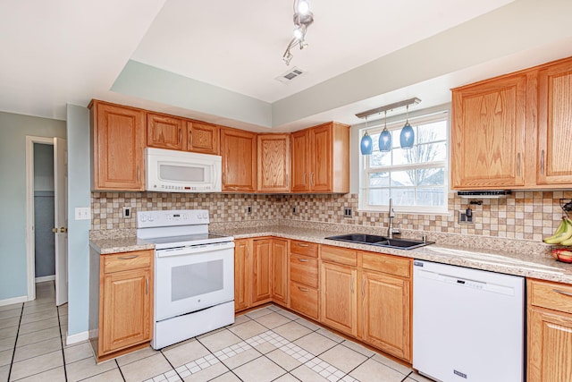 kitchen featuring visible vents, a sink, white appliances, light tile patterned flooring, and light countertops