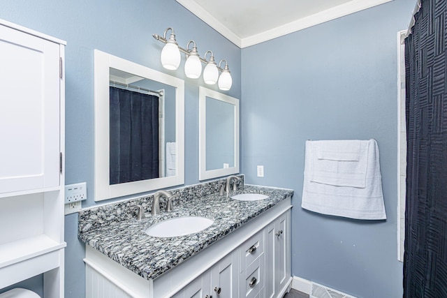 bathroom with double vanity, ornamental molding, and a sink