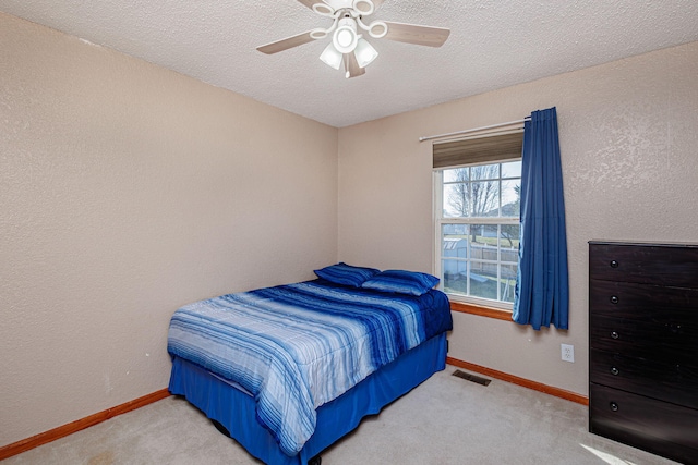 bedroom with visible vents, baseboards, and carpet