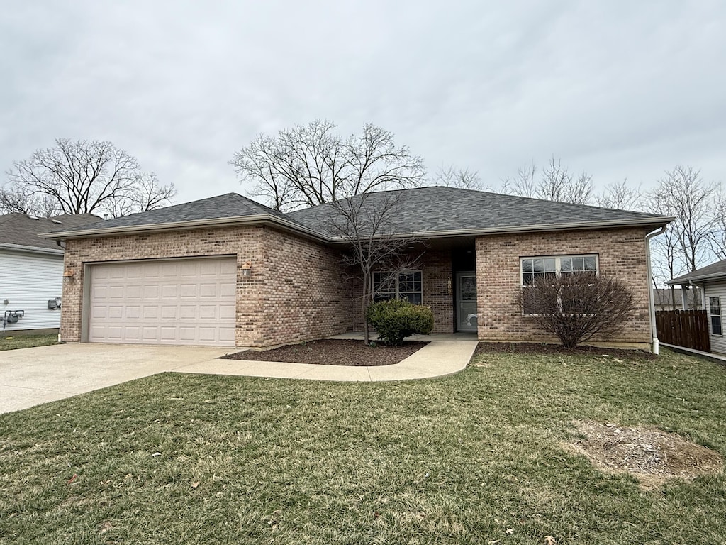 single story home with a front yard, roof with shingles, concrete driveway, a garage, and brick siding