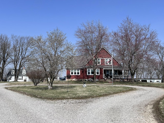 view of front of house with a front yard and driveway