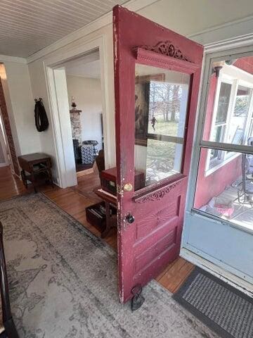 details with ornamental molding and wood finished floors