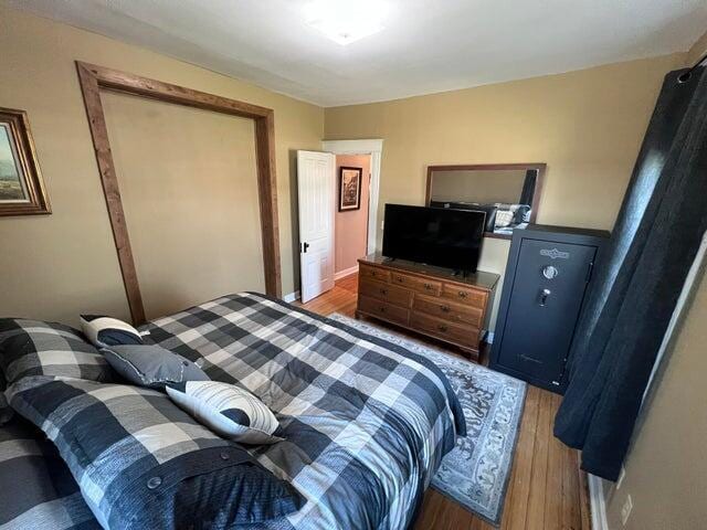 bedroom featuring wood finished floors