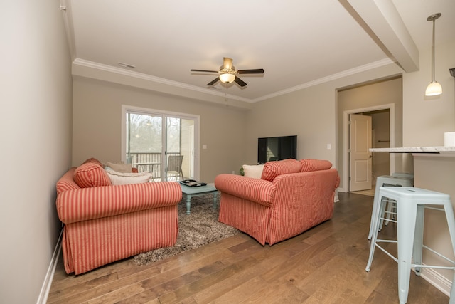 living area with light wood-style flooring, a ceiling fan, and ornamental molding