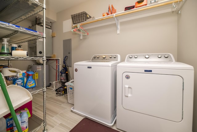 laundry room featuring laundry area, washer and dryer, and electric water heater