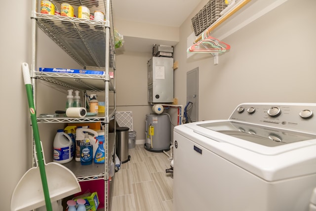 laundry room with water heater, laundry area, and washer / clothes dryer