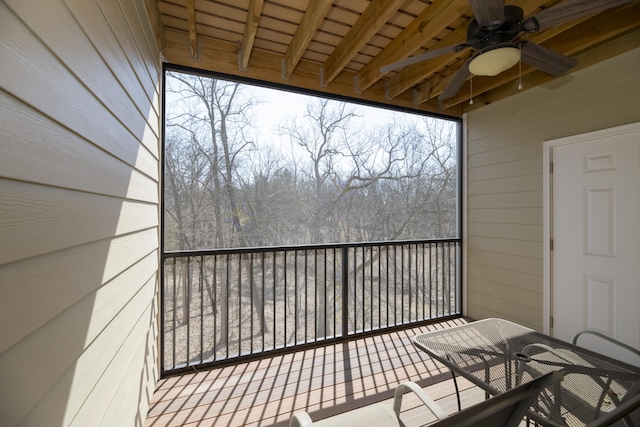 balcony featuring outdoor dining area and a ceiling fan