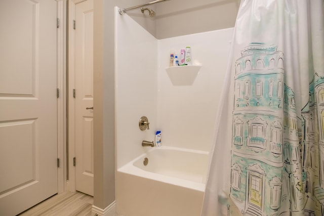 bathroom featuring shower / bath combo with shower curtain