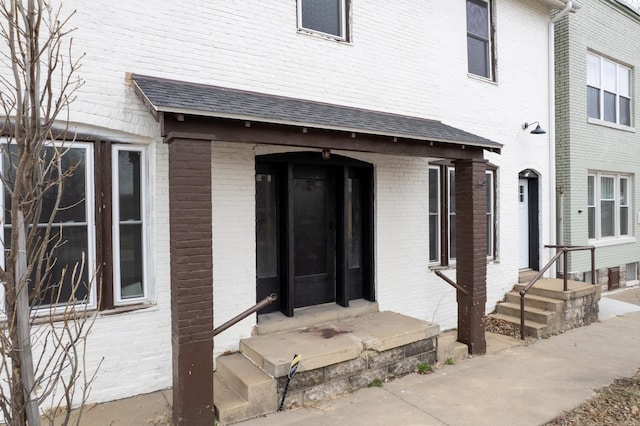 property entrance with brick siding