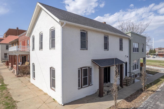 exterior space featuring brick siding