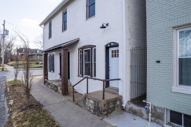 view of side of property with brick siding