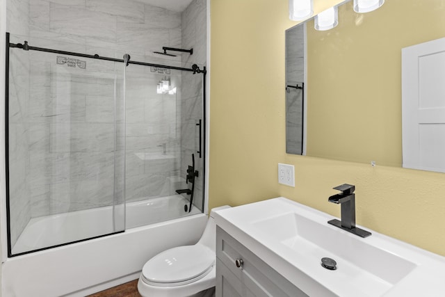 bathroom with vanity, toilet, and enclosed tub / shower combo