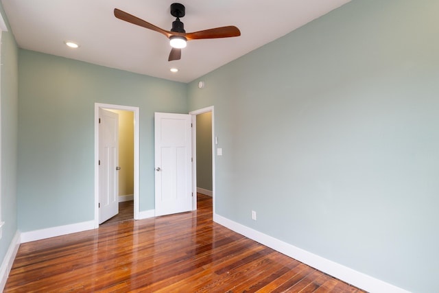 unfurnished bedroom featuring a ceiling fan, recessed lighting, wood finished floors, and baseboards