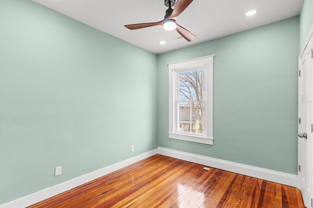 unfurnished room featuring recessed lighting, baseboards, ceiling fan, and hardwood / wood-style flooring