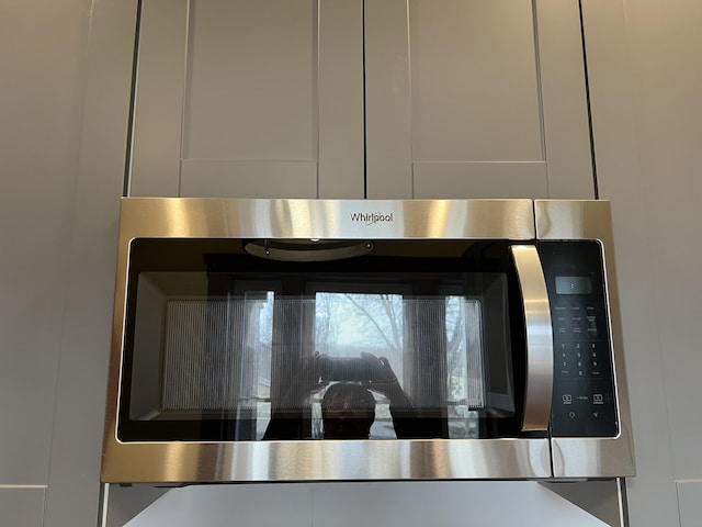 interior details with stainless steel microwave and oven