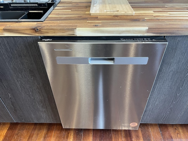 details featuring stainless steel dishwasher and wood finished floors