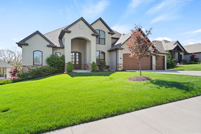 french provincial home featuring stone siding, stucco siding, and french doors