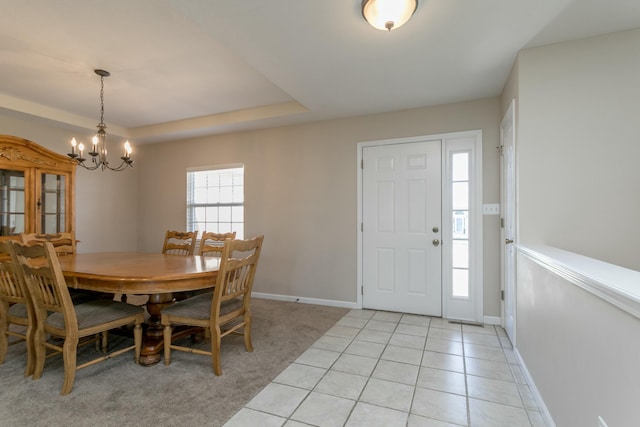 4612 Manhasset Dr, Columbia, MO 65203 - dining room with light tile patterned flooring, baseboards, and a notable chandelier