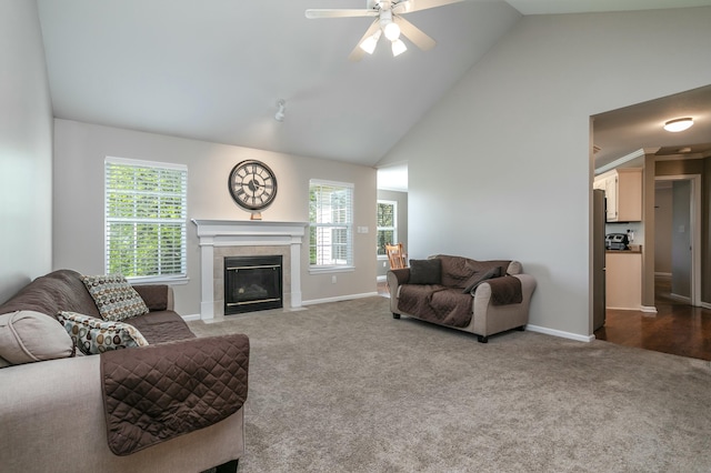 4612 Manhasset Dr, Columbia, MO 65203 - living area featuring a fireplace, dark colored carpet, a wealth of natural light, and ceiling fan