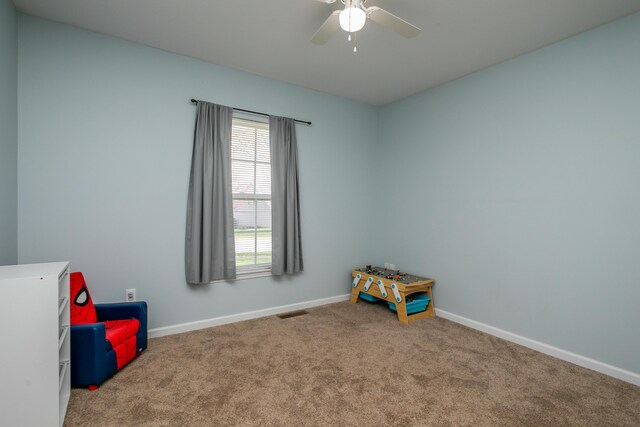 4612 Manhasset Dr, Columbia, MO 65203 - recreation room with ceiling fan, baseboards, carpet flooring, and visible vents
