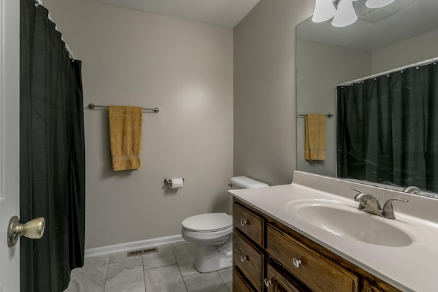4612 Manhasset Dr, Columbia, MO 65203 - full bathroom featuring toilet, vanity, visible vents, and baseboards