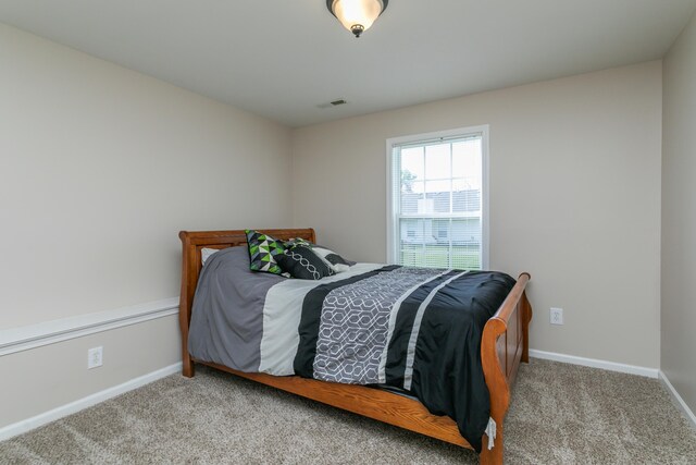 4612 Manhasset Dr, Columbia, MO 65203 - bedroom with baseboards, visible vents, and carpet flooring