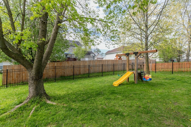 4612 Manhasset Dr, Columbia, MO 65203 - view of yard featuring a fenced backyard and a playground