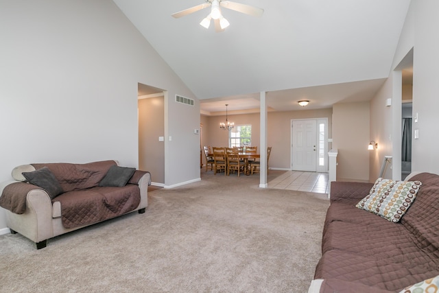 4612 Manhasset Dr, Columbia, MO 65203 - carpeted living room with high vaulted ceiling, baseboards, visible vents, and ceiling fan with notable chandelier