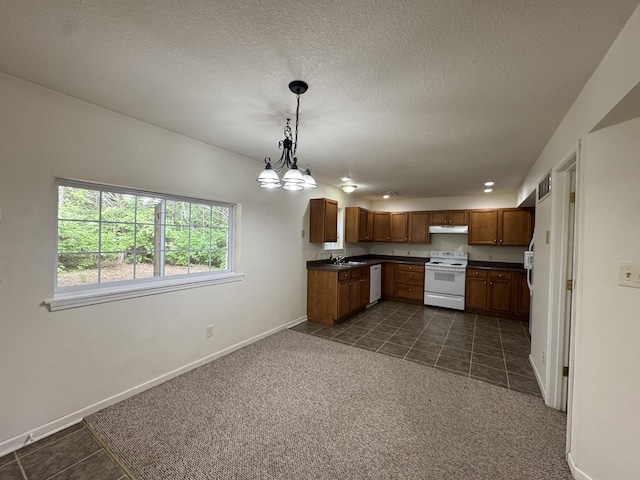 6112 E Forsee Rd, Ashland, MO 65010 - kitchen with white appliances, a sink, under cabinet range hood, dark countertops, and baseboards