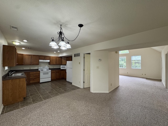 6112 E Forsee Rd, Ashland, MO 65010 - kitchen with white appliances, open floor plan, dark countertops, a sink, and under cabinet range hood