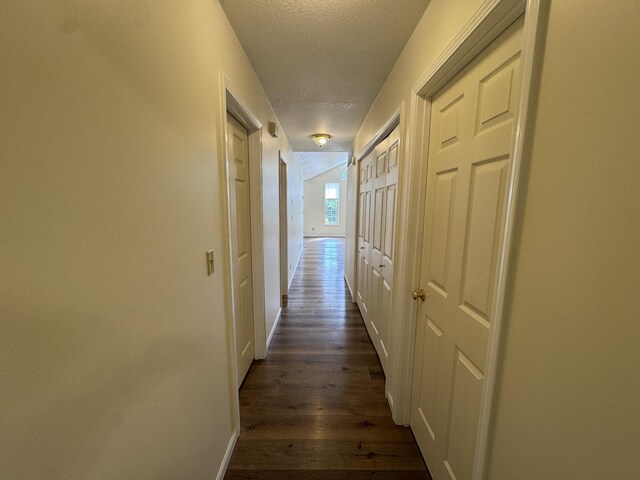 6112 E Forsee Rd, Ashland, MO 65010 - corridor with a textured ceiling, dark wood-type flooring, and baseboards
