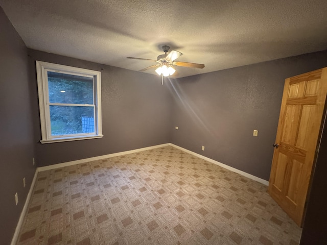 6112 E Forsee Rd, Ashland, MO 65010 - unfurnished room featuring a ceiling fan, a textured ceiling, and baseboards
