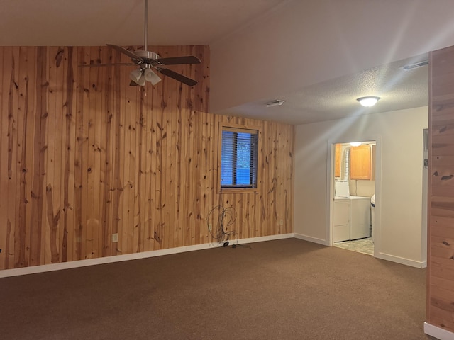 6112 E Forsee Rd, Ashland, MO 65010 - additional living space featuring separate washer and dryer, wood walls, baseboards, carpet flooring, and a ceiling fan