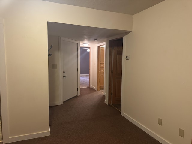 6112 E Forsee Rd, Ashland, MO 65010 - hallway featuring dark colored carpet and baseboards