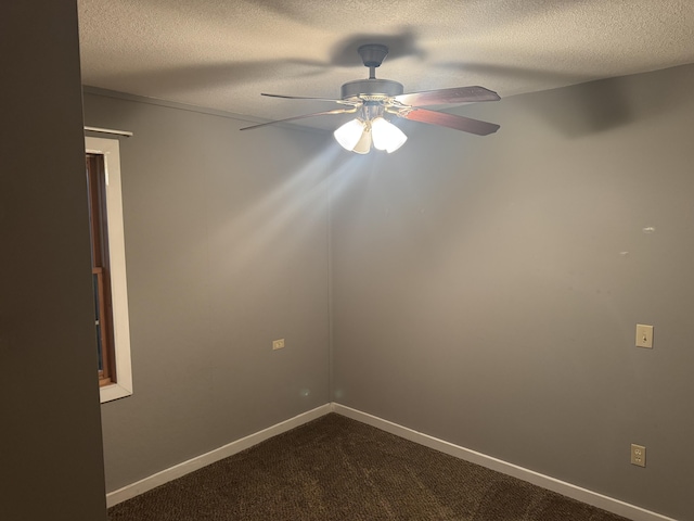 6112 E Forsee Rd, Ashland, MO 65010 - unfurnished room with ceiling fan, dark carpet, a textured ceiling, and baseboards