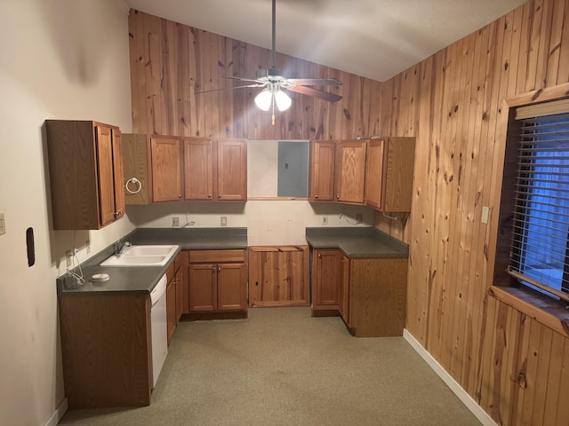 6112 E Forsee Rd, Ashland, MO 65010 - kitchen featuring a sink, brown cabinetry, wood walls, dark countertops, and ceiling fan