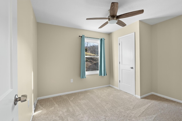 27206 Lakeside Ln, Barnett, MO 65011 - unfurnished bedroom featuring carpet flooring, baseboards, and ceiling fan