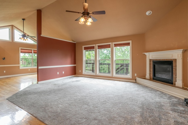606 Billy Joe Sapp Dr, Ashland, MO 65010 - unfurnished living room featuring a ceiling fan, baseboards, high vaulted ceiling, a fireplace, and wood finished floors