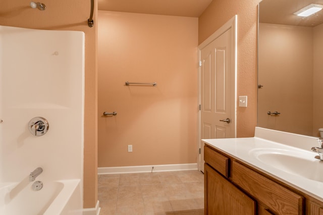 606 Billy Joe Sapp Dr, Ashland, MO 65010 - bathroom featuring vanity, tile patterned flooring, shower / bathtub combination, and baseboards