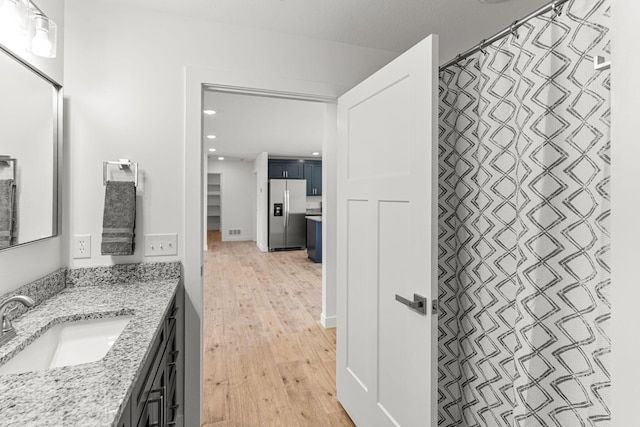 35 Andy Ct, Clark, MO 65243 - full bath featuring wood finished floors, vanity, and recessed lighting